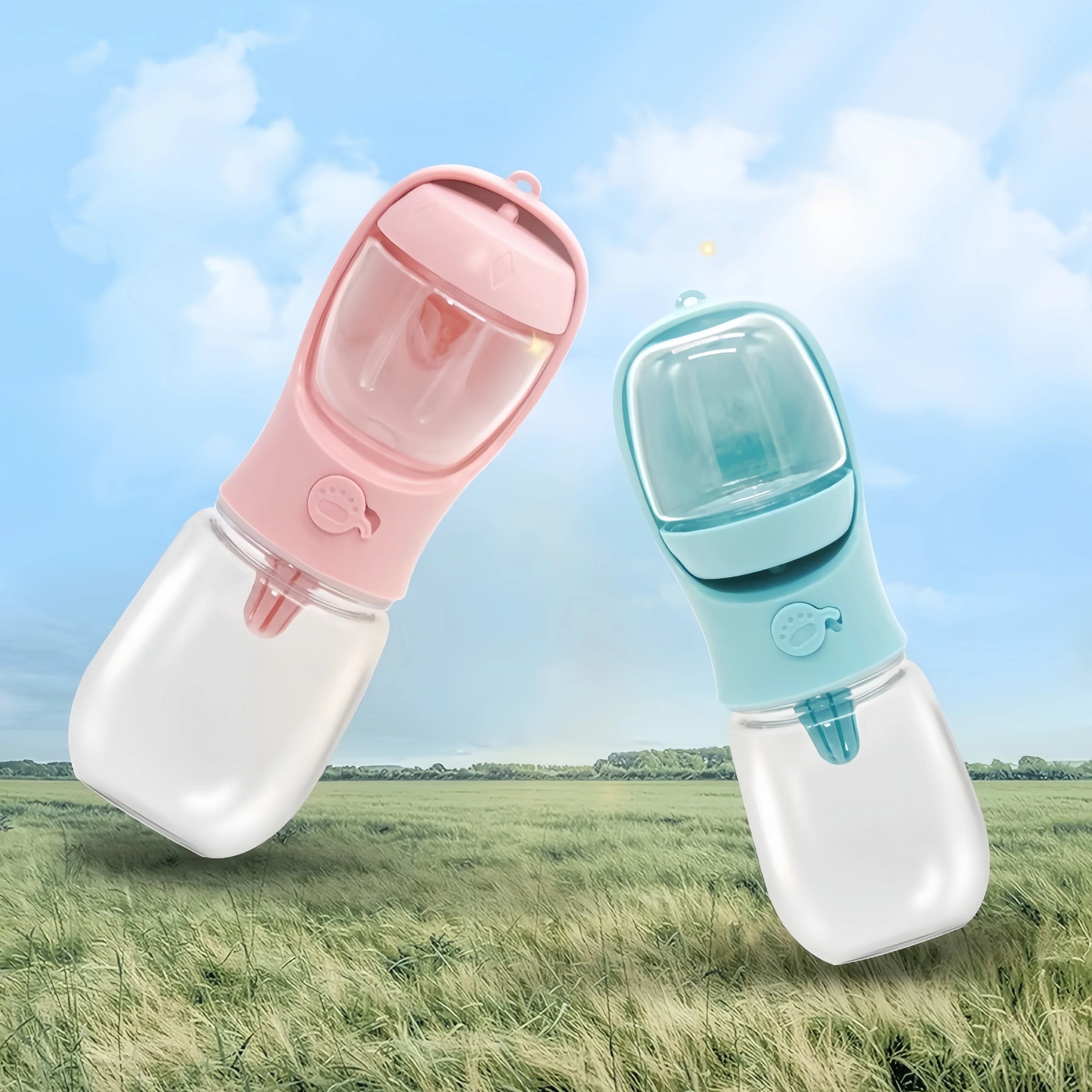 Pink and blue Furmont portable pet water and food bottles floating above a grassy field under a blue sky.